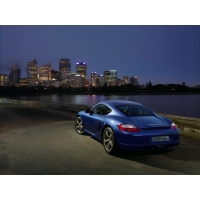 Синий Porsche Cayman S на фоне города - фотографии на рабочий стол, тема - авто и мото